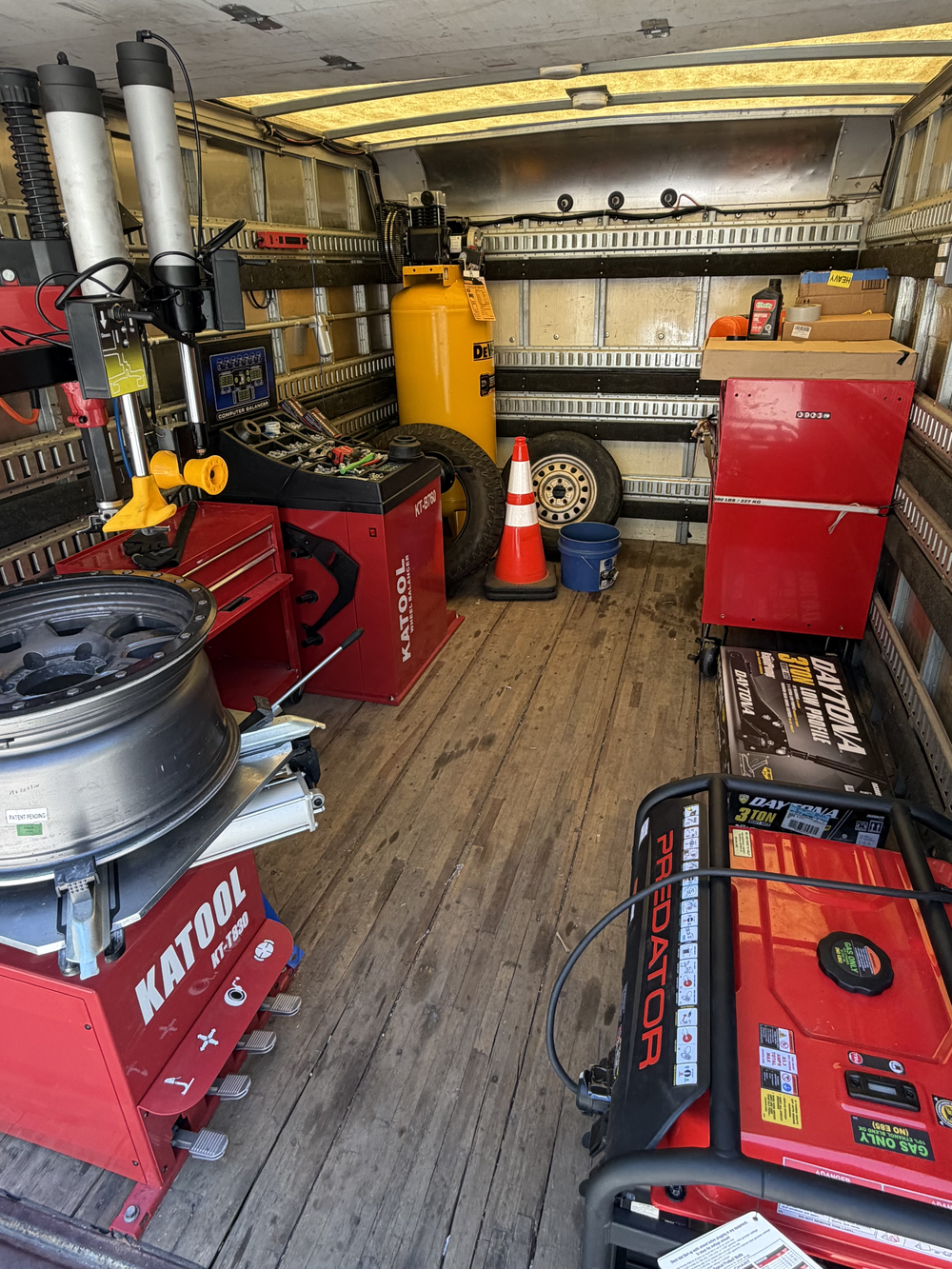 Inside JC Mobile Tire & Auto's fully equipped service truck — tire changer, wheel balancer, compressor and generator